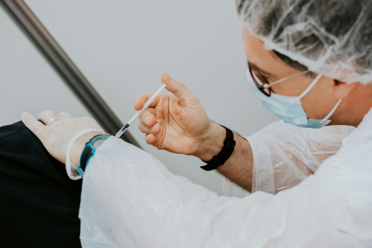 doctor giving vaccine injection
