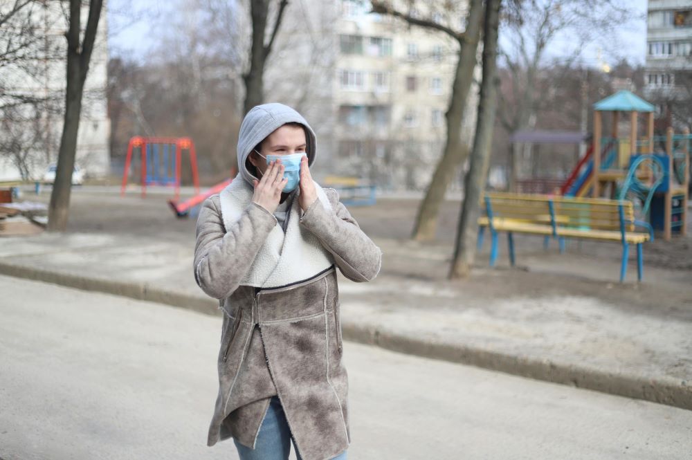 young woman with face mask in the cold